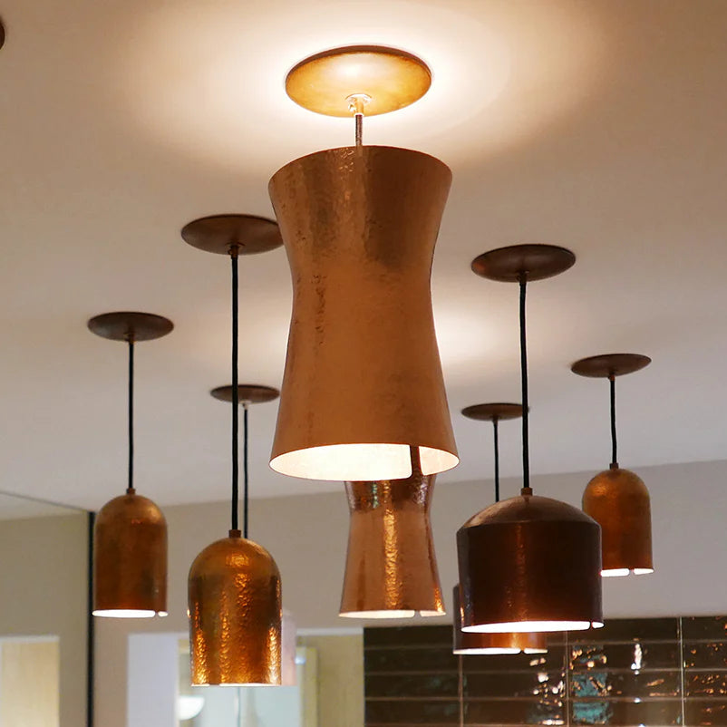 Copper pendant lights hanging from the ceiling